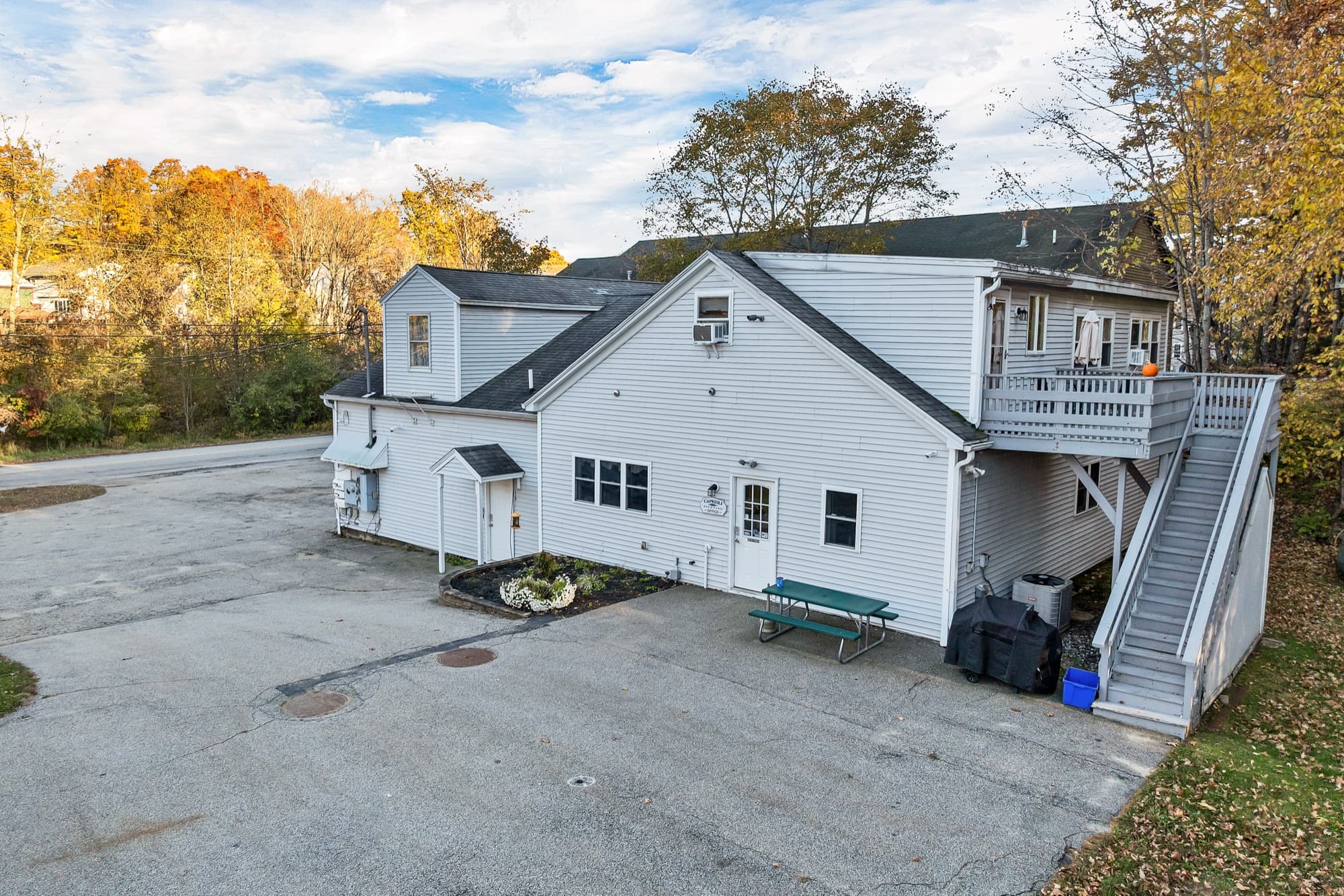 The end of the building with the 2-bedroom apartment's deck and its exterior stair